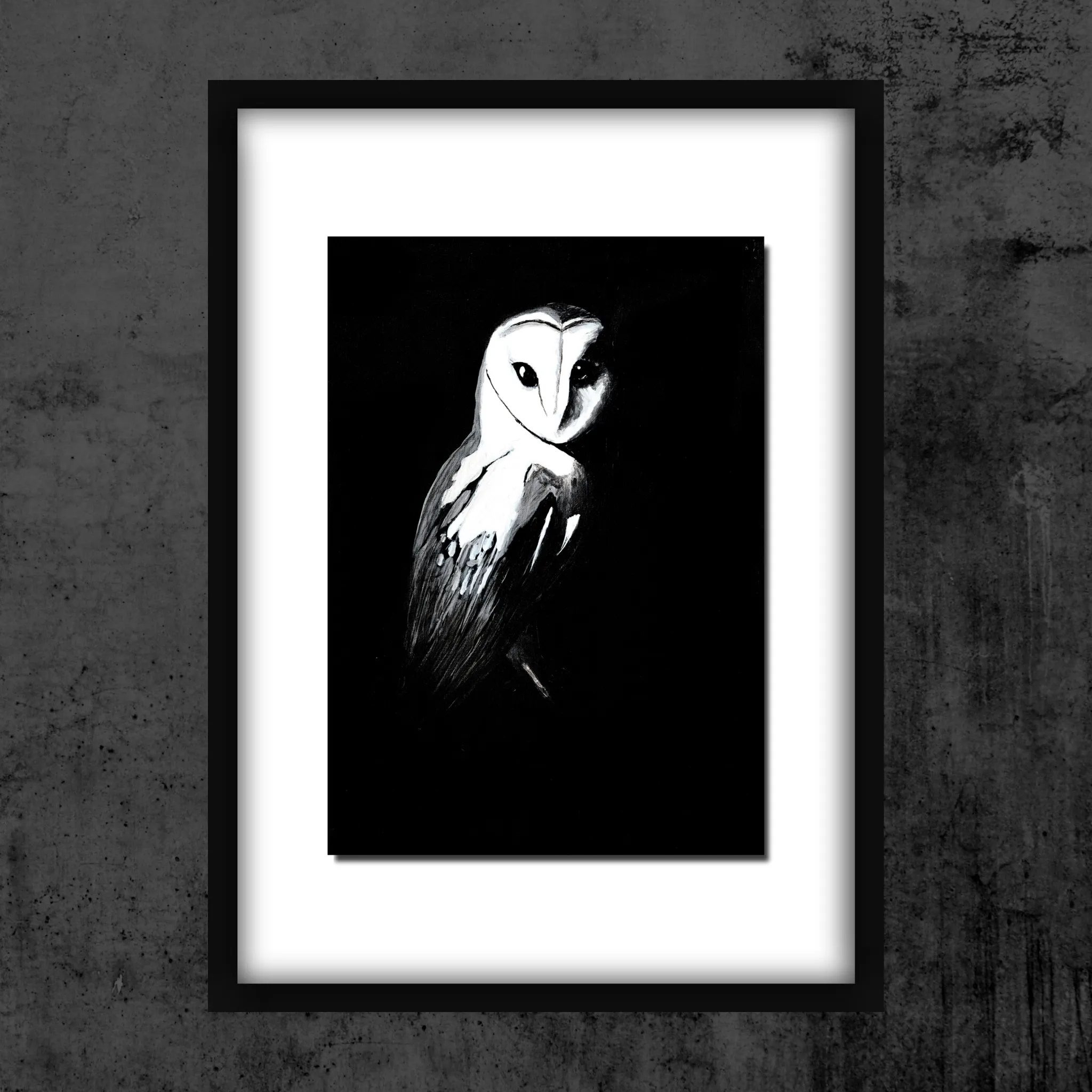 A framed black-and-white Active Void print of a barn owl hanging on a textured charcoal wall