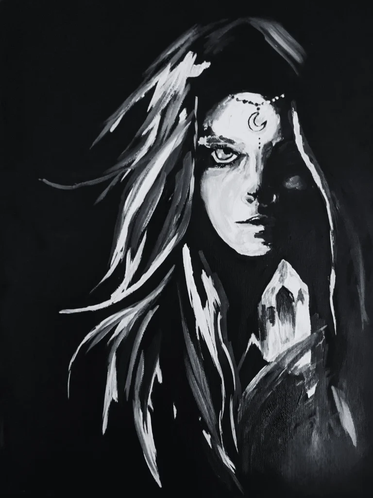 A monochrome portrait with one side of the face lit while the other recedes into black.